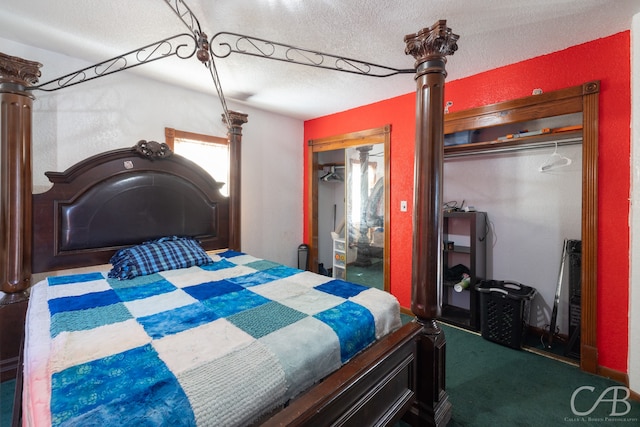 bedroom featuring carpet, a closet, and a textured ceiling