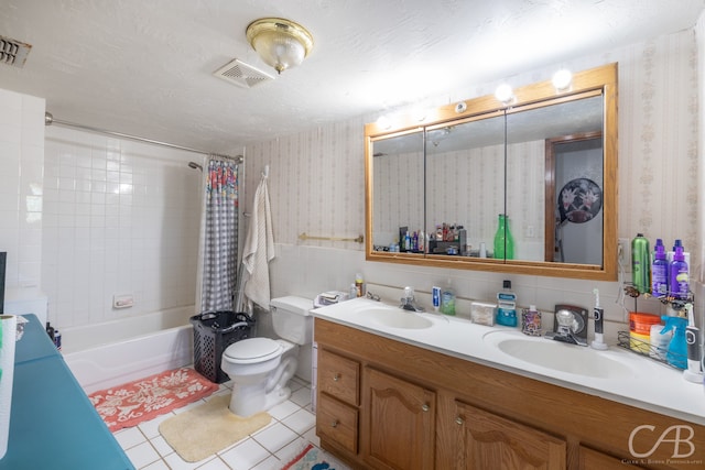 full bathroom featuring shower / tub combo with curtain, tasteful backsplash, tile patterned floors, double sink vanity, and toilet