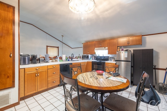 kitchen with sink, vaulted ceiling, light tile patterned floors, and black appliances