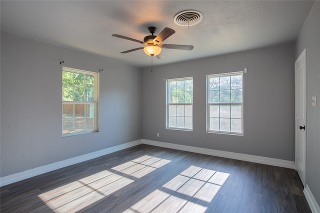 spare room featuring ceiling fan and wood-type flooring