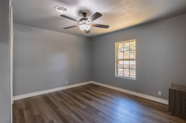 spare room featuring ceiling fan, hardwood / wood-style flooring, and a textured ceiling