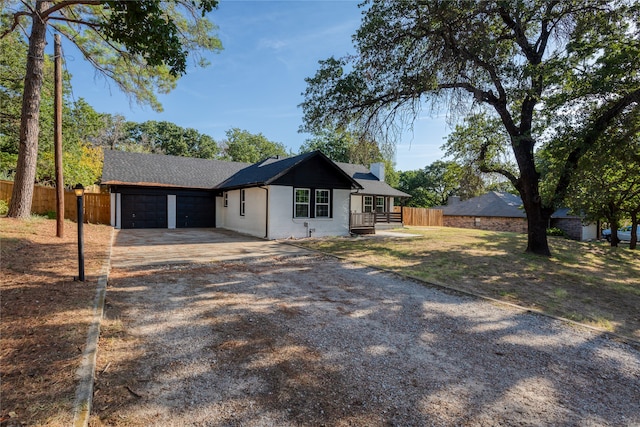 ranch-style home featuring a garage