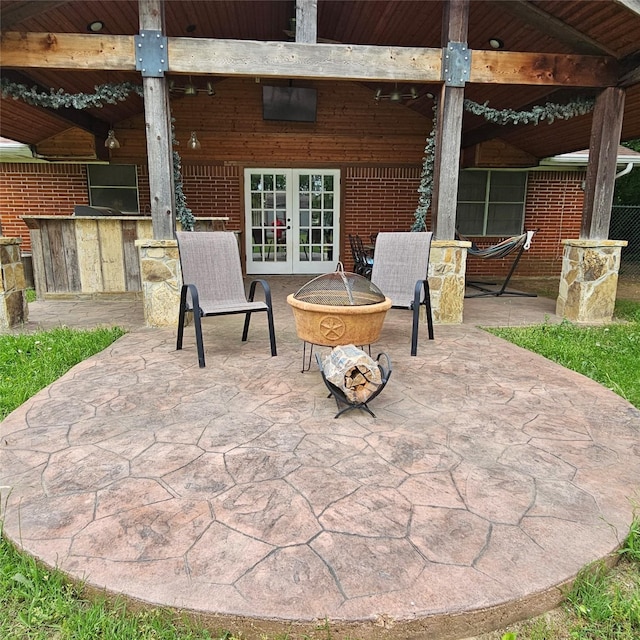 view of patio featuring a fire pit and french doors