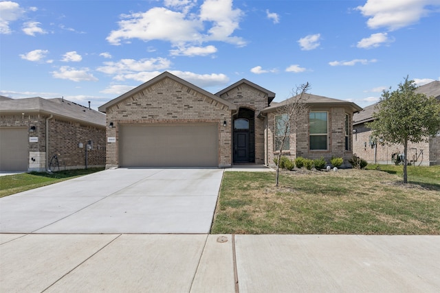 view of front of home with a garage and a front yard