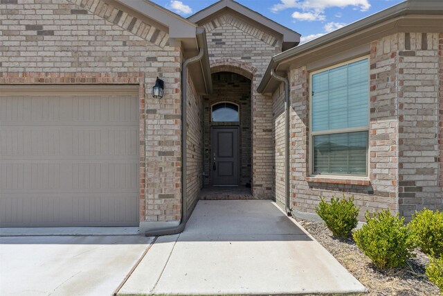 property entrance with a garage