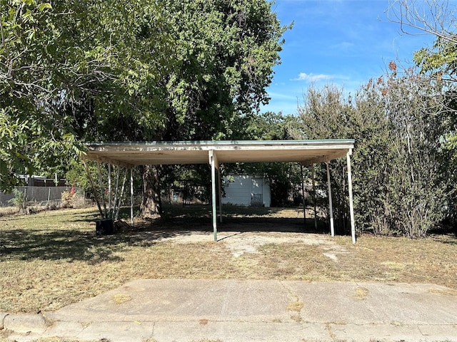 view of vehicle parking featuring a carport