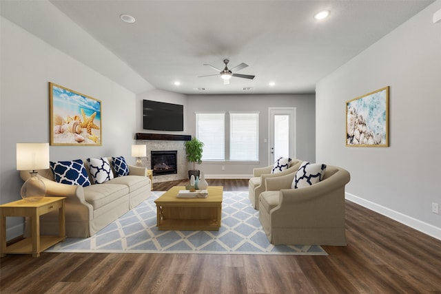 living room with ceiling fan and dark hardwood / wood-style floors