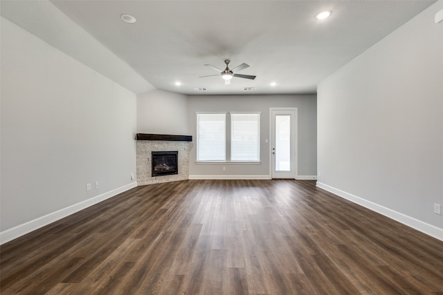 unfurnished living room with lofted ceiling, ceiling fan, and dark hardwood / wood-style floors