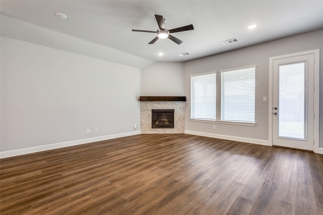 unfurnished living room featuring vaulted ceiling, ceiling fan, and dark hardwood / wood-style flooring