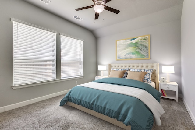 carpeted bedroom with ceiling fan and lofted ceiling