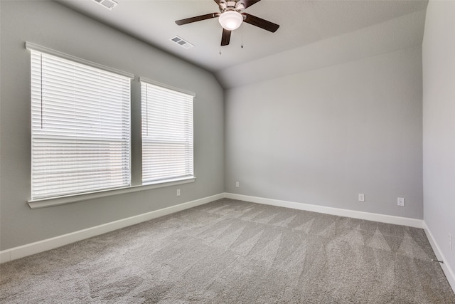 carpeted empty room with lofted ceiling and ceiling fan