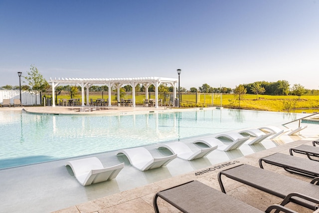 view of pool featuring a pergola and a patio