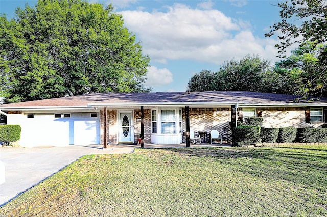 ranch-style house featuring a garage and a front yard