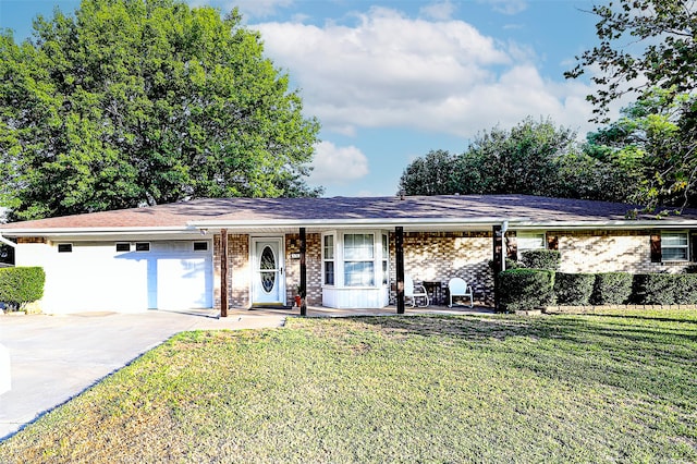 ranch-style home with a front lawn and a garage