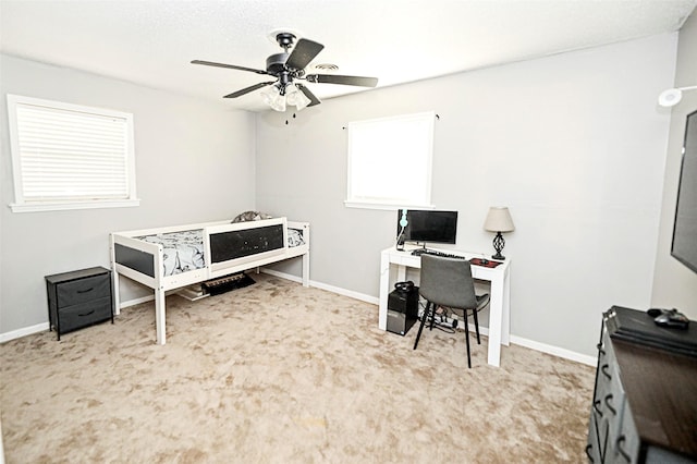 bedroom with ceiling fan and light carpet