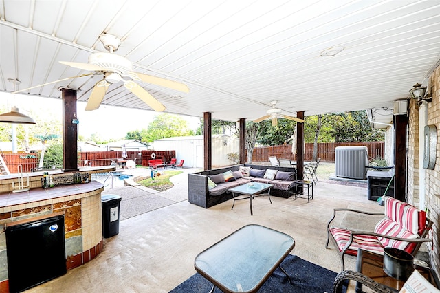 view of patio / terrace with cooling unit, a fenced in pool, an outdoor hangout area, and ceiling fan