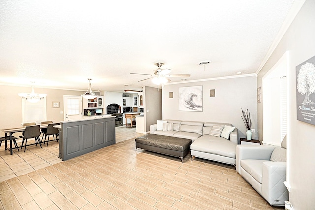 living room featuring crown molding and ceiling fan