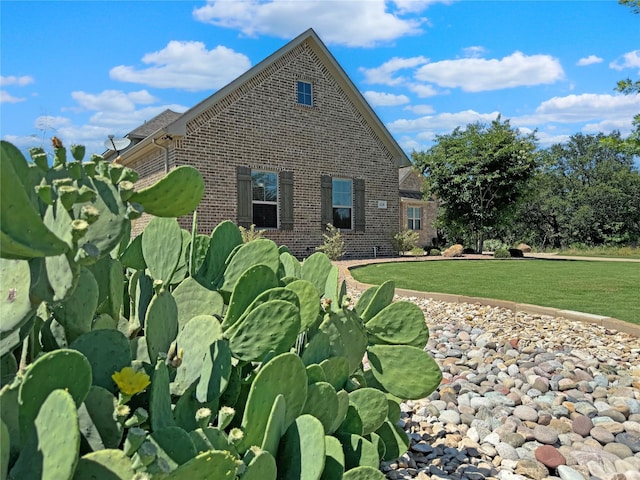 view of property exterior featuring a lawn