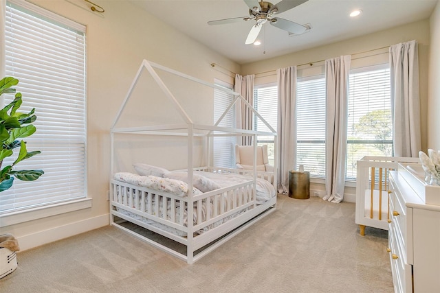 carpeted bedroom featuring ceiling fan