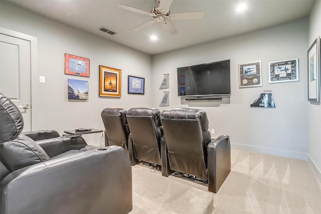 carpeted cinema featuring ceiling fan