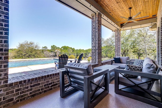 view of patio with ceiling fan, an outdoor hangout area, and a fenced in pool