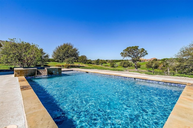 view of pool featuring pool water feature and a jacuzzi