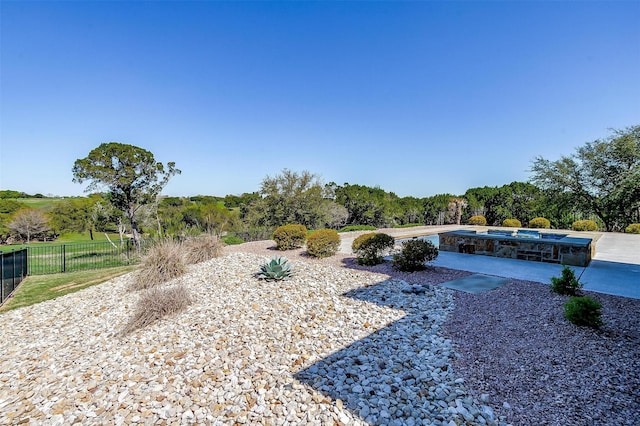 view of yard featuring a patio and a fenced in pool