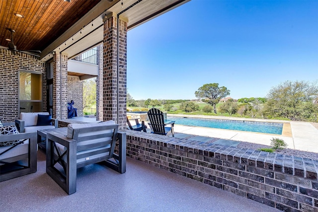 view of patio with ceiling fan and an outdoor hangout area