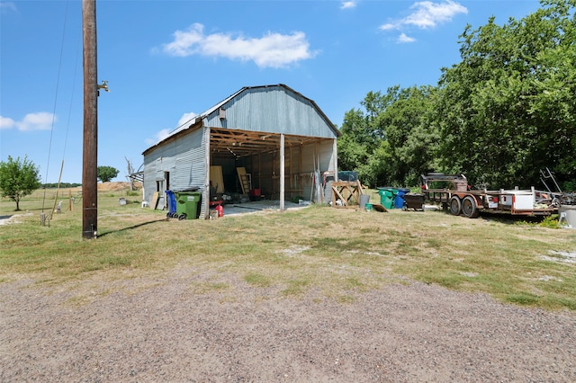 view of outbuilding featuring a yard