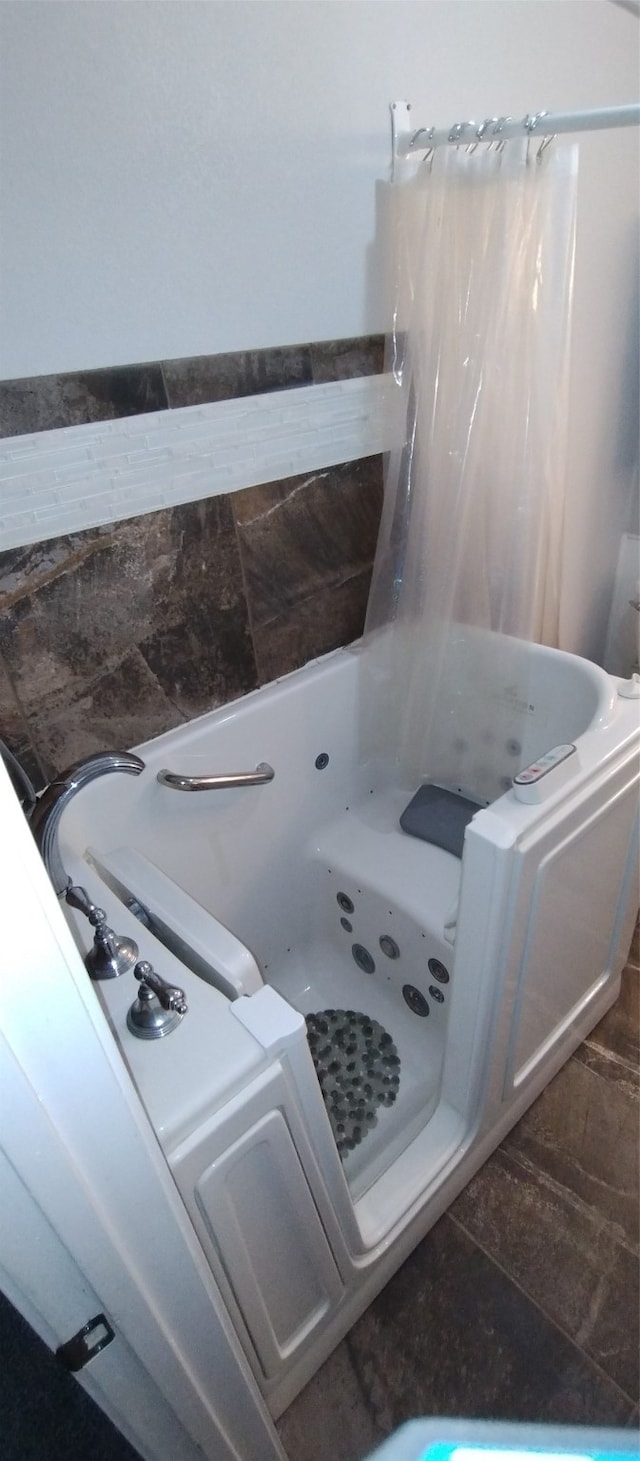 bathroom featuring independent shower and bath and tile patterned floors