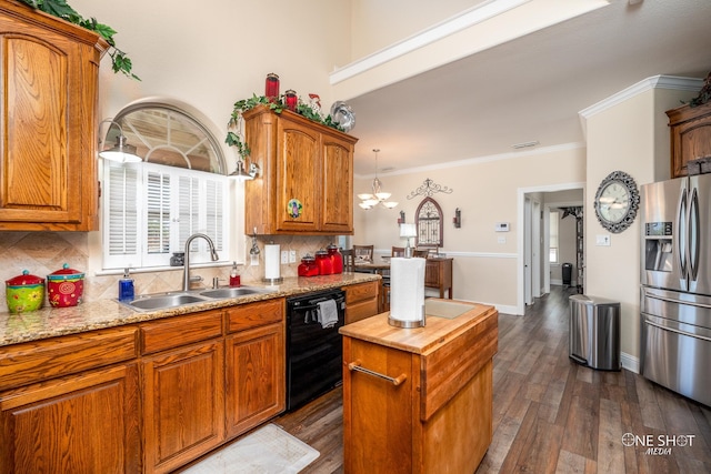 kitchen with decorative backsplash, black dishwasher, sink, and stainless steel refrigerator with ice dispenser