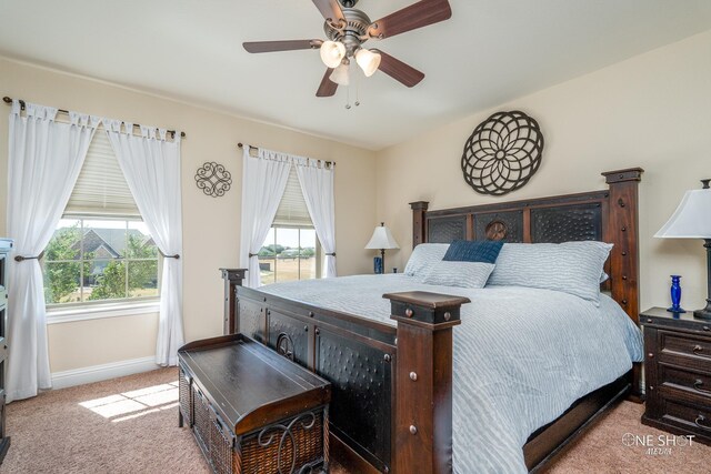 carpeted bedroom with ceiling fan