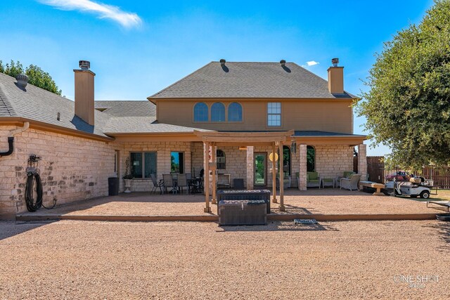 back of house with a patio area