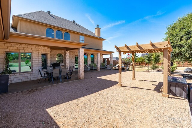 exterior space with a pergola and a patio