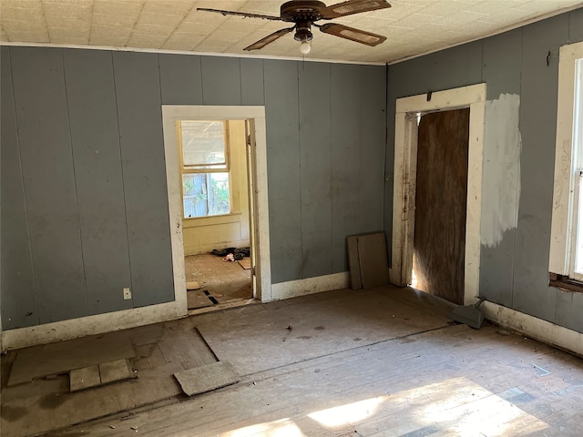 unfurnished room with ceiling fan