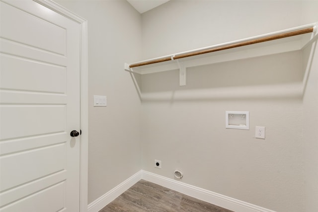 laundry room with hardwood / wood-style flooring, hookup for an electric dryer, hookup for a washing machine, and hookup for a gas dryer