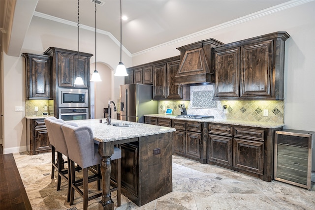 kitchen with premium range hood, pendant lighting, tasteful backsplash, beverage cooler, and stainless steel appliances