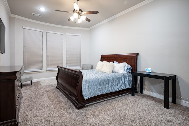 bedroom featuring ceiling fan, crown molding, and light carpet