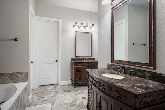 bathroom featuring tile patterned flooring, a bathtub, and dual bowl vanity