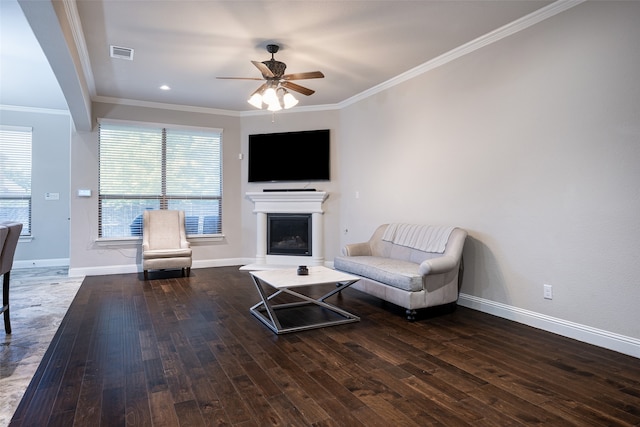 unfurnished living room featuring ceiling fan, hardwood / wood-style floors, and ornamental molding