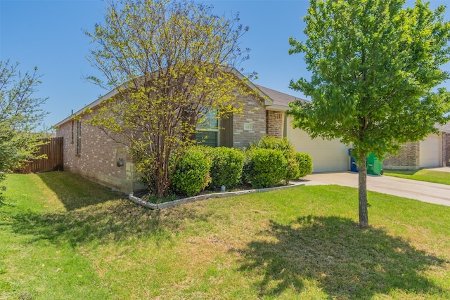 view of front facade with a garage and a front yard