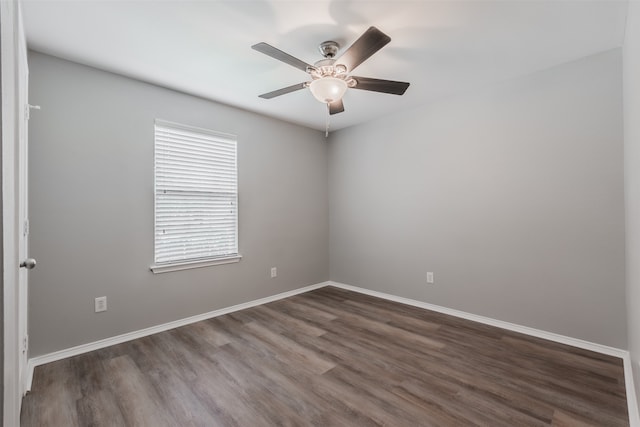 spare room featuring hardwood / wood-style floors and ceiling fan