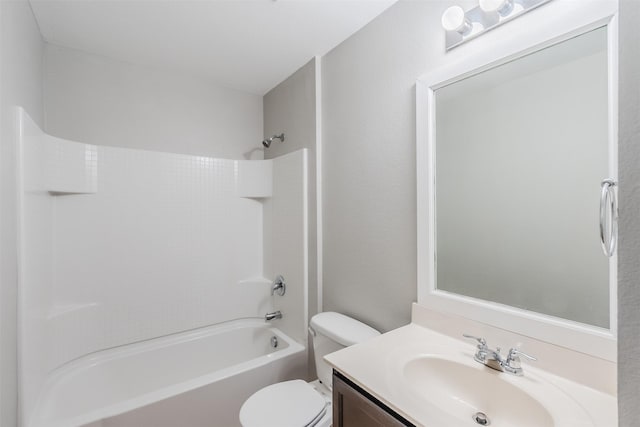 bathroom featuring toilet, shower / washtub combination, and vanity