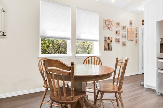 dining room with hardwood / wood-style flooring