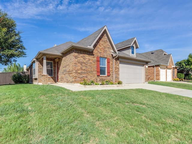 view of front of house featuring a garage and a front yard