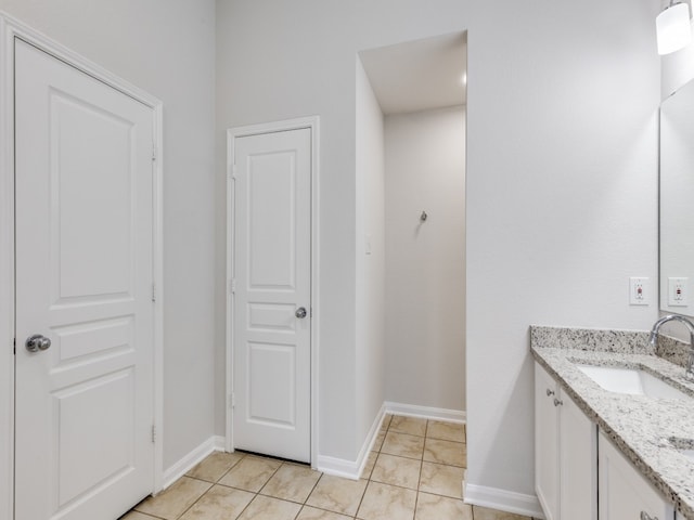 bathroom with vanity and tile patterned floors