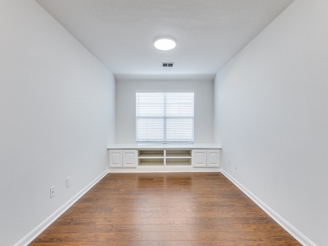 spare room featuring hardwood / wood-style floors