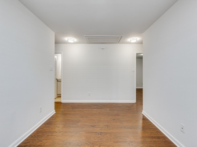 spare room featuring wood-type flooring