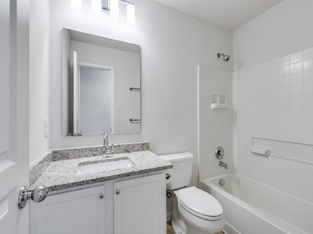 full bathroom featuring shower / bathtub combination, vanity, and toilet