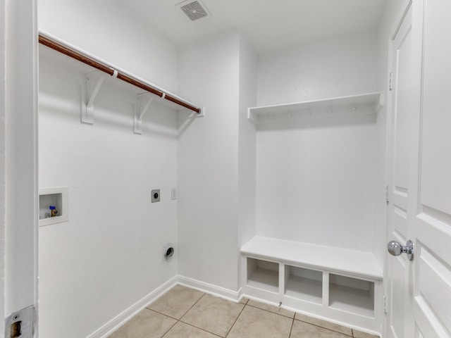 clothes washing area featuring light tile patterned floors, electric dryer hookup, and washer hookup